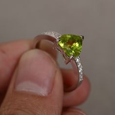 This is a gorgeous handmade creation. Its beauty is its simplicity & Elegance. The 8 mm heart cut faceted natural Peridot is crafted in solid sterling silver and with rhodium plated. Peridot is August birthstone. All item is sent in a beautiful gift box You can realize more lovely stuff clicking the link https://www.etsy.com/shop/knightjewelry?refshopsection_shophome_leftnav Please leave the correct address and you phone number for delivering successfully. White Gold Heart Ring With Gemstone, White Gold Heart Ring With Gemstone Round Cut, White Gold Heart Ring With Round Cut Gemstone, Green Sterling Silver Heart Cut Rings, Green Heart Cut Sterling Silver Rings, Heart-shaped Sterling Silver Diamond Ring, Peridot Ring With Brilliant Cut, Green Peridot Crystal Ring For May Birthstone, Heart Ring Engagement