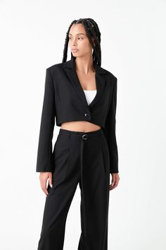 Our Oversized Cropped Blazer is the perfect addition to your wardrobe. Sleek and refined, it features a skinny lapel, collar, and shoulder pads that create a modern silhouette. Perfect for both casual and formal wear, this blazer strikes just the right balance between boldness and sophistication. With its edgy cropped style, you won't find a more fashionable and chic outerwear piece. Get yours today and look your best! Cropped Skinny lapel Collar Shoulder pads Button closure Front pockets Lining Hand wash cold Do not bleach Iron low Do not tumble dry Exclusive of Decoration Shell: 75% Polyester 20% Rayon 5%Spandex Lining: 97% Polyester 3%Spandex AY178J Total length: 17" Bust: 38" ‚ Chic Outerwear, Cropped Blazer, Cropped Style, Look Your Best, Black Blazers, Lapel Collar, Formal Wear, Shoulder Pads, Hand Wash