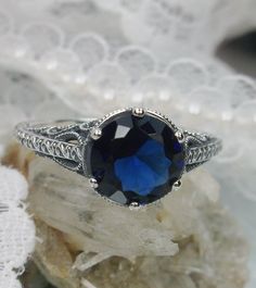 Gaze at the blue night sky #etsy shop: 2ct Round Cut Simulated Blue Sapphire Gem Sterling Silver Elegant Intricate Filigree Ring Size (Made To Order) {Design#167} https://etsy.me/2LZNEbL #jewelry #ring #silver #no #yes #girls #blue #sapphire #floral Engraved Sapphire Jewelry For Wedding, Round Sapphire Filigree Wedding Ring, Wedding Filigree Sapphire Ring, Classic Sapphire Jewelry With Intricate Design, Classic Engraved Round Sapphire Ring, Blue Filigree Ring With Intricate Design For Anniversary, Classic Blue Filigree Ring For Wedding, Elegant Blue Filigree Ring With Intricate Design, Blue Sapphire Ring With Intricate Design For Wedding