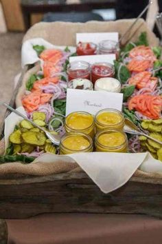 a table topped with lots of food and condiments on top of each other