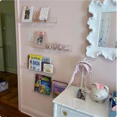 there are many books on the shelves in this room, including children's books