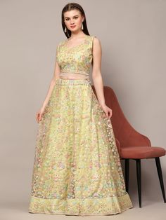 Introducing our glamorous light yellow sequins net engagement wear lehenga choli, a stunning piece that is sure to make you stand out on any special occasion. This fully stitched lehenga set comes in a beautiful light yellow color, made from high-quality net material adorned with exquisite sequin work and multi-thread embroidery.
The matching choli features the same intricate sequin work and thread embroidery, while the net dupatta completes the look with sequin work, multi-thread work, and a ch Semi-stitched Yellow Choli For Reception, Party Yellow Lehenga With Sequins, Party Yellow Sequined Choli, Traditional Yellow Sequined Choli, Embellished Yellow Semi-stitched Choli, Light Yellow Color, India Country, Stitched Lehenga, Net Fabric