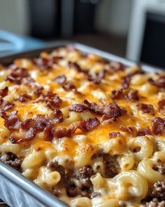 a casserole dish with cheese and meat in it