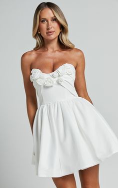 Angeletta Mini Dress - Sweetheart Rosette Detail Fit & Flare in White | Showpo Spring Mini-length Bridesmaid Corset Dress, Spring Bridesmaid Mini Corset Dress, White Feminine Corset Dress With Ruched Bodice, Feminine Mini Dress With Sweetheart Neckline For Prom, Summer Bridesmaid Mini Dress With Sweetheart Neckline, Summer Bridal Shower Dress With Sweetheart Neckline, Flirty Mini Wedding Dress, Flirty Mini Dress For Wedding, White Strapless Mini Dress With Ruched Bodice