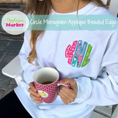 a woman holding a cup of coffee with the words circle morgan applique beaded edge on it