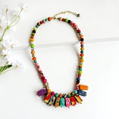 A colorful textile-wrapped beaded necklace features a fan of rectangular beads. Rectangle Necklace, Special Style, Women Artisans, Textiles, India, Fan, Beads, Color