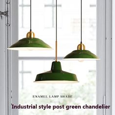 two green lamps hanging from a window sill in front of a window with the words industrial style post green chandelier