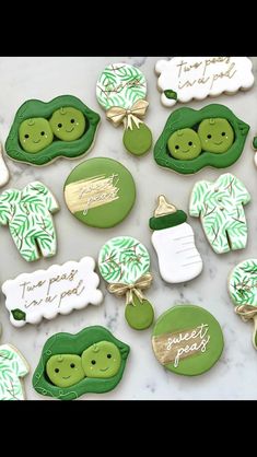 decorated cookies with green and white designs on them