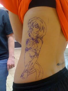 the back of a woman's stomach with a drawing on it