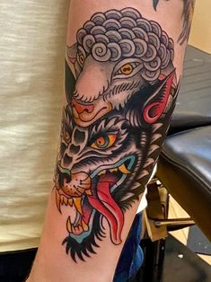 a man with a tattoo on his arm has a tiger and dragon design on it