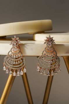 Elevate your elegance with our stunning lightweight and dainty chandbali earrings (small), measuring 1.7 inches in length. These lightweight earrings are designed with a secure push-back closure, ensuring a comfortable fit. Available in three luxurious finishes—rhodium-plated, rose gold-plated, and gold-plated—each pair is adorned with dazzling white AD stones that catch the light beautifully. The intricate design features multiple tiers of sparkling stones, creating a captivating and sophistica Chandbali Earrings, Lightweight Earrings, Light Weight Earrings, Rose Gold Earrings, Intricate Design, Chandelier Earrings, Rose Gold Plates, Rhodium Plated, Or Rose