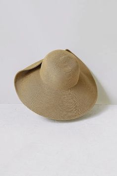 Elegantly Asymmetrical, Uniquely Stylish Straw Hat Perfect for summer outings, this asymmetrical wide brim straw hat offers exceptional sun protection. Made from fine cellulose fibers, it combines lightness and structure. The 14cm brim provides ample shade, while the vintage-inspired design with a German alloy button adds a touch of elegance. The hat folds easily for travel without obstructing your view. Style #: WWAJ515 Wide Brim Straw Hat, Resort Wear Dresses, Tank Top Skirt, Black Backless Dress, Casual Activewear, Cellulose Fiber, Wide Brim Sun Hat, Butter Yellow, Silk Knit