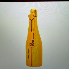 a yellow bottle with a zipper attached to it sitting on a white surface in front of a screen