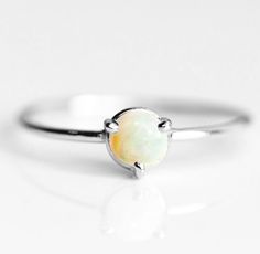 Artisan Ethiopian Opal Ring, 925 Sterling Silver, Round Gemstone, Affordable Silver Ring, Cheap Ring, Can Be Personalized, Christmas, Sale Ring Metal :- 925 Sterling Silver (Stamp on the Product) **Gemstone Size depends on the Ring Size.** **The Product you will receive may vary from the image as no two gemstone are similar and images cannot define exact product definitions.** Shipping Policy:- I mainly use DHLE, PPS, FedEx for the shipping of goods depending on the amount and days that you have Adjustable White Gold Opal Birthstone Ring, Opal Birthstone Ring In White Gold For Gift, Fine Jewelry Opal Ring With Round Band As Gift, Gift White Gold Opal Gemstone Ring, White Gold Opal Gemstone Ring For Gift, Fine Jewelry Opal Ring As A Gift, Opal Solitaire Ring Gift, Silver Solitaire Opal Ring In Fine Jewelry Style, Round Solitaire Opal Ring Gift