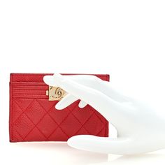 This is an authentic CHANEL Caviar Quilted Boy Card Holder in Red. This fashionable card case is crafted of pebbled caviar leather in red. It features a small gold Chanel CC logo on the front and opens to a matching fabric interior. Red Chanel, Gold Chanel, Chanel Caviar, Chanel Wallet, Card Holder Wallet, Cc Logo, Card Case, Dust Bag, Card Holder