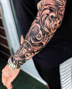 a man with a tattoo on his arm