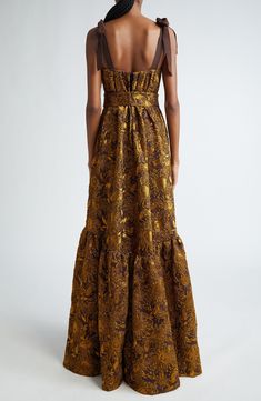 Make an unforgettable entrance at your next gala event in this opulent gown crafted of shimmering crinkled brocade patterned in a stunning sunflower motif. A structured bodice with grosgrain-ribbon straps and beaded brooches balances the full flounced-hem skirt that's completed with handy pockets. 61" length (size 6) Hidden back-zip closure Square neck Adjustable tie straps Side-seam pockets Lined 68% nylon, 21% polyester, 11% elastane Dry clean Made in the USA Designer Clothing Brown Sunflower, Brocade Gown, Sunflower Motif, Gala Event, Beaded Brooches, Brocade Dresses, Gala Events, Lela Rose, Hem Skirt