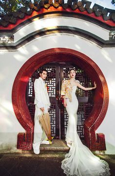 a man and woman dressed in traditional chinese garb