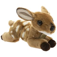 a small stuffed deer laying on its side