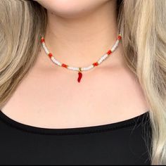 Chilli Lucy Charm Necklace 🌶️ 🌶️Very similar to the evil eye, the chilli good luck charm is believed to protect its bearer from the envy and harmful intent of others🌶️ 🧿Beaded Necklace, Made with glass beads. Necklace non adjustable, Lobster Clasp, Made with Elastic String. 🧚🏼The Chilli charm is made from Gold coated Zinc Alloy⚠️which may tarnish when it comes in contact with water⚠️ ✈️Product Price Includes Shipping. (This may vary on International orders) 🐉Message me more personalisatio White Round Beads Jewelry For Good Luck, Red Letter Beads Festival Jewelry, Adjustable Spiritual Necklace With Letter Beads, Bohemian Red Necklace With Letter Beads, Red Bohemian Necklace With Letter Beads, Spiritual Adjustable Necklace With Letter Beads, Red Glass Bead Necklaces, Chili Jewelry, Pepper Necklace