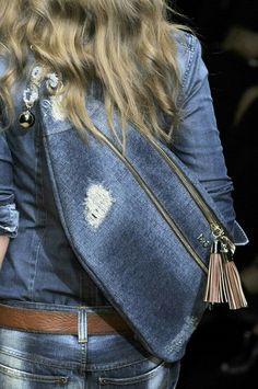 a close up of a woman's purse on the runway