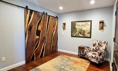 a living room with blue walls and wooden floors