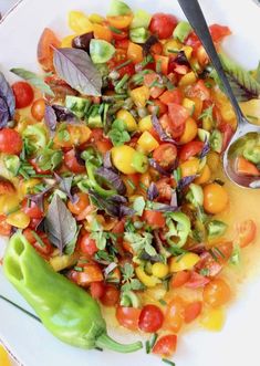 a white plate topped with lots of different types of vegetables