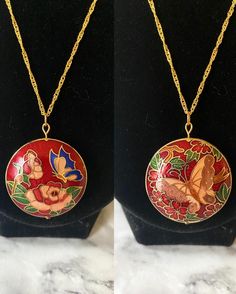 Vintage red floral butterfly reversible cloisonné enamel round puffy pendant on 18K gold plated wave chain. Each side is a different design! I cleaned the pendant to the best of my abilities. The head pin and jump ring are 18K gold plated. Comes in a box. Please keep in mind that the pendant itself is vintage so it may show some signs of age/wear which includes any signs of chipping or tarnishing. If you need a chain of another length, please select in the menu. If you need a chain length not li Red Butterfly Necklace For Gift, Red Enamel Round Necklace, Red Enamel Round Pendant Necklace, Gold Hand-painted Round Pendant Necklace, Floral Butterfly, Enamel Necklaces, Cloisonne Enamel, Head Pins, The Menu