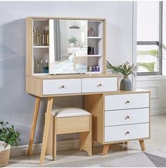 a wooden vanity with mirror and stool in a room