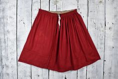 "Step back in time and embrace the enchanting allure of this traditional vintage skirt. With its timeless charm and nostalgic appeal, this ethnic skirt  is a true treasure for any fashion enthusiast. The rich red hue adds a touch of warmth and passion to your wardrobe, while the rustic detailing and vintage-inspired design create an air of authenticity. Crafted with this skirt exudes a bohemian vibe and effortlessly captures the essence of retro fashion. This vintage rustic red skirt is sure to Bohemian Red Cotton Skirt, Bohemian Embroidered Red Skirt, Red Ruffled Bohemian Skirt, Vintage Flowy Red Skirt, Bohemian Red Non-stretch Skirt, Peasant Skirt, Boho Skirt, Red Skirt, Fashion Enthusiast