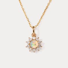 Elevate your everyday style with the timeless beauty of the Selenichast Opal Necklace. Designed for effortless elegance, this stunning necklace features a mesmerizing opal pendant that exudes a captivating play of colors. Its sleek and versatile design makes it the perfect accessory for any occasion, whether it's a casual outing or a formal affair. The high-quality craftsmanship ensures durability and longevity, allowing you to enjoy its beauty day after day. Make a statement with the Selenichas Elegant Opal Clavicle Chain Jewelry, Elegant Round Opal Necklace, Delicate Opal Gemstone Necklaces, Elegant Opal Necklaces, Elegant Opal Round Pendant Jewelry, Delicate Gold Opal Necklace, Elegant Round Opal Pendant Jewelry, Yellow Gold Ethiopian Opal Round Necklace, Yellow Gold Ethiopian Opal Necklace