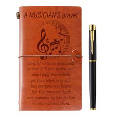 a note book with a pen next to it and the words, a musician's prayer