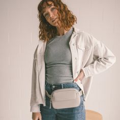 Keep your essentials close with our ANYWHERE belt bag. Don't be fooled by its size - we've packed plenty of functionality and intentional storage into this petite bag. It comes with a card holder that fits securely in an interior slip pocket, has an easy adjust webbing strap and can be worn as a traditional belt bag or crossbody style. It's the perfect belt bag to take you ANYWHERE. What Makes It Perfect • 1 zipper pocket in the back • 1 secure slip pocket in front with magnetic flap • 3 interio Travel Rectangular Belt Bag With Functional Pockets, Rectangular Travel Belt Bag With Functional Pockets, Travel Belt Bag With Functional Pockets, Modern Bags With Pockets For On-the-go, Functional Camera Bag With Removable Pouch For Everyday, Everyday Functional Satchel Camera Bag, Versatile Belt Bag For On-the-go, Shoulder Bag With Functional Pockets, Trendy Bags With Functional Pockets For On-the-go