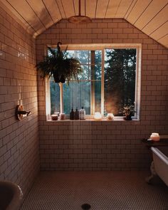 a bath room with a tub and a window