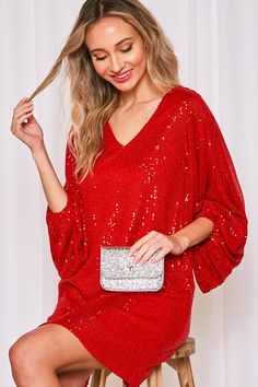 Get ready to party in our It's Party Time Red Sequin Mini Dress! Featuring a V-neckline, long balloon sleeves, and solid sequin detailing, this fully lined dress offers a relaxed fit and all-day comfort. Perfect for holiday parties, Christmas celebrations, and other festive occasions, or elevate your birthday or night out look with some EXTRA Razorback flair. Just add high heels for a super hot look! * Model is 5'8, 32-27-37, wearing SMALL Red Glitter Dress, Red Sequin Mini Dress, Sequin Kimono, Sequin Pencil Skirt, Tiktok Outfits, Red Sequin, Ruffle Hem Dress, La Fashion, Sequin Mini