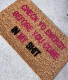 a brown door mat with words written on it