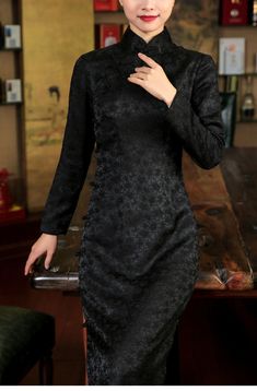 This Old Shanghai Qipao features a pure black color and a slim fit design, perfect for a flattering look. It has a full-open front and is adorned with handmade frog buttons for an elegant touch. The traditional qipao has three-quarter length sleeves, making it a stylish choice for any occasion. Ideal for mothers or anyone looking for a classic yet chic outfit. Size Chart: S: Shoulder width-36cm, Chest-84cm, Waist-68cm, Hip-86cm M: Shoulder width-37cm, Chest-88cm, Waist-72cm, Hip-90cm L: Shoulder Fitted Long Sleeve Cheongsam For Evening, Black Fitted Formal Cheongsam, Formal Black Fitted Cheongsam, Black Fitted Cheongsam For Formal Occasions, Elegant Long Sleeve Fitted Cheongsam, Frog Buttons, Traditional Qipao, Old Shanghai, Pure Black