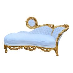 a white and gold chaise lounge with an oval mirror on the back side,