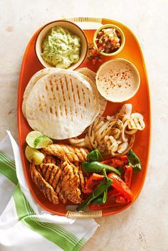 an orange tray filled with different types of food