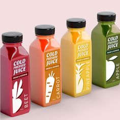 four different colored juices are lined up in a row