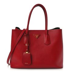 This is an authentic PRADA Saffiano Cuir Large Double Bag in Fuoco and Black. This bold tote is crafted of Prada Saffiano cross-grain leather in red. The bag features rolled leather top handles, an optional shoulder strap and gold hardware.There is a partitioned interior and snaps at the side for expansion lined with black leather. Red Bag Aesthetic, Prada Saffiano, Handbag Heaven, Bags Aesthetic, Tote Bag Design, Leather Top, Gold Hardware, Prada, Grain