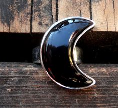 "☾Handmade, Natural Black Onyx Sterling Silver Moon Statement Rings☾ ❤︎Featured in this listing is a sterling silver, handmade, natural stone ring. This lovely ring features a beautiful, Natural Black Onyx Large Moon shaped stone. The Black Onyx Moon has been bezel set into a highly polished, Sterling Silver, sturdy setting. ❤︎Wide gradual band from 4-6mm ❤︎These large 1\" Moons in black onyx have been highly polished, with a rise of 7mm ❤︎Each ring has been hand made, so may vary slightly Stone Mystical Black Sterling Silver Rings, Unique Black Jewelry With Moon Phase, Unique Black Moon Phase Jewelry, Black Crescent Celestial Jewelry, Celestial Black Crescent Jewelry, Mystical Nickel-free Black Jewelry, Mystical Black Nickel-free Jewelry, Black Nickel-free Mystical Jewelry, Celestial Black Sterling Silver Jewelry