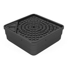 a black plastic tray with holes in the center and bottom, on a white background