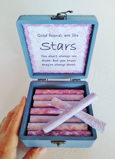 someone is holding up a box with candles in it that say, good friends are like stars you don't always see them