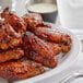 a plate full of fried chicken next to a glass of milk