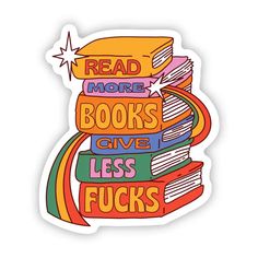 a sticker that says read more books give less fuks on top of a stack of books