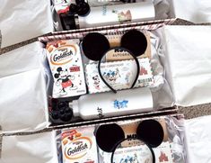 three mickey mouse products are sitting in a box