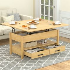 a living room with a couch, coffee table and two drawers on the bottom shelf