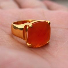 D E T A I L S - Material: Sterling Silver 925Stone: CarnelianThe Fit: True to US ring size Finish: Smooth and gold-filled to a high shineUpgrade your accessory collection today with this must-have piece, & flaunt your style statementS H I P P I N G & P R O D U C T I O N - My current production time is 2-6 business days, which means after those days are up, your order ships! I make everything custom to order, by hand, but I promise you it's worth the wait!R U S H - M Y - O R D E R -If you Classic Carnelian Jewelry For Anniversary, Classic Chalcedony Ring Jewelry, Classic Carnelian Rings With Polished Finish, Classic Chalcedony Rings As Gift, Anniversary Carnelian Signet Ring With Polished Finish, Classic Orange Rings With Polished Finish, Orange Polished Jewelry For Anniversary, Classic Carnelian Jewelry Hallmarked, Yellow Gold Carnelian Signet Ring Gift