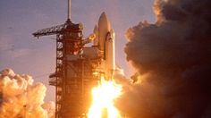 the space shuttle lifts off into the sky